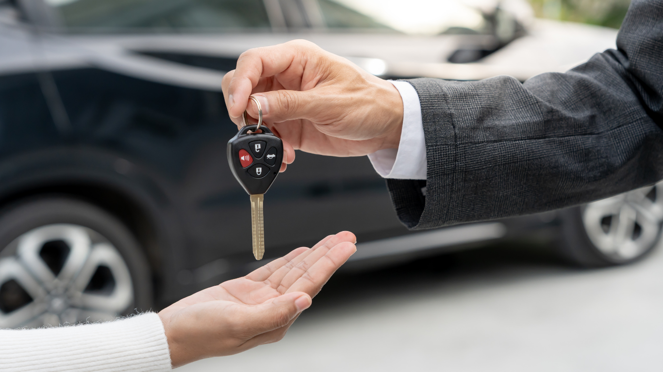 Driver behind the wheel of a vehicle during daytime commute, representing reliable transportation after loan approval.